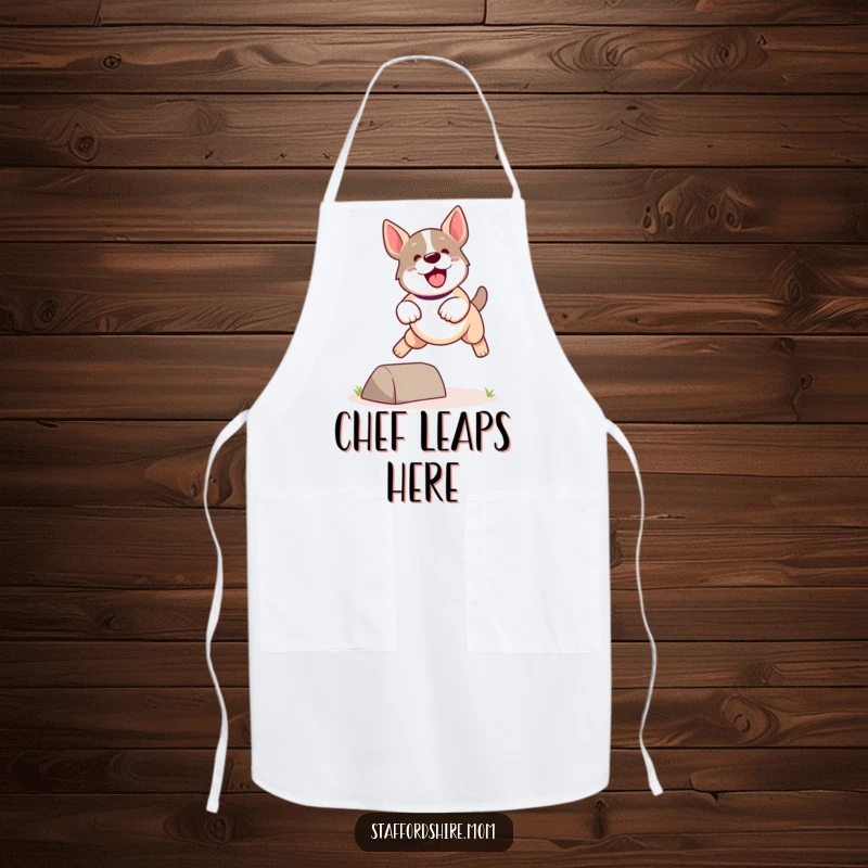 Funny Kawaii Staffordshire Dog Apron showcasing a cute, energetic dog leaping dynamically over a small obstacle, kitchen fun.