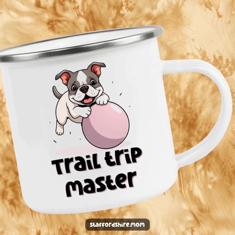 Funny Staffordshire Bull Terrier camping mug depicting a dog hilariously tripping over a giant ball, for enjoying drinks with a smile.