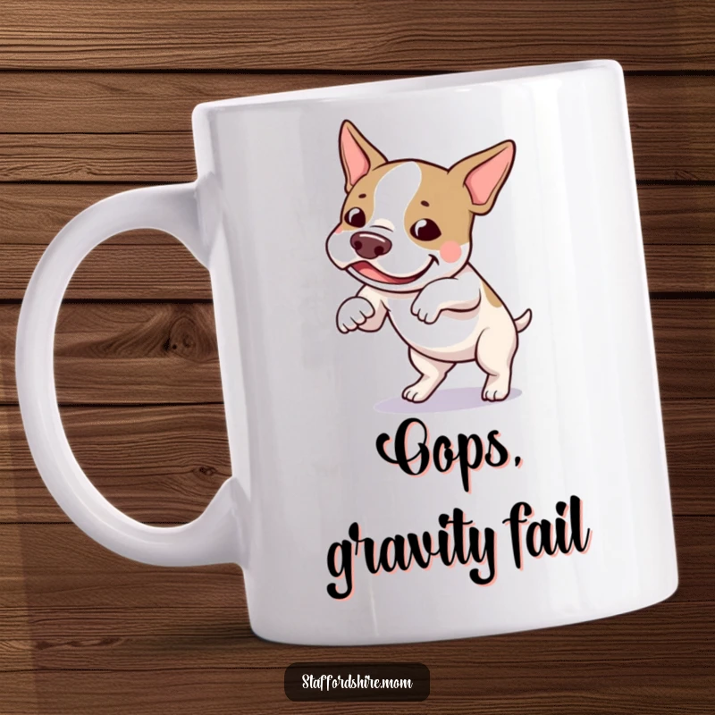 Funny Staffordshire bull terrier mug showing a dog playfully tripping over its own feet with an amused expression.