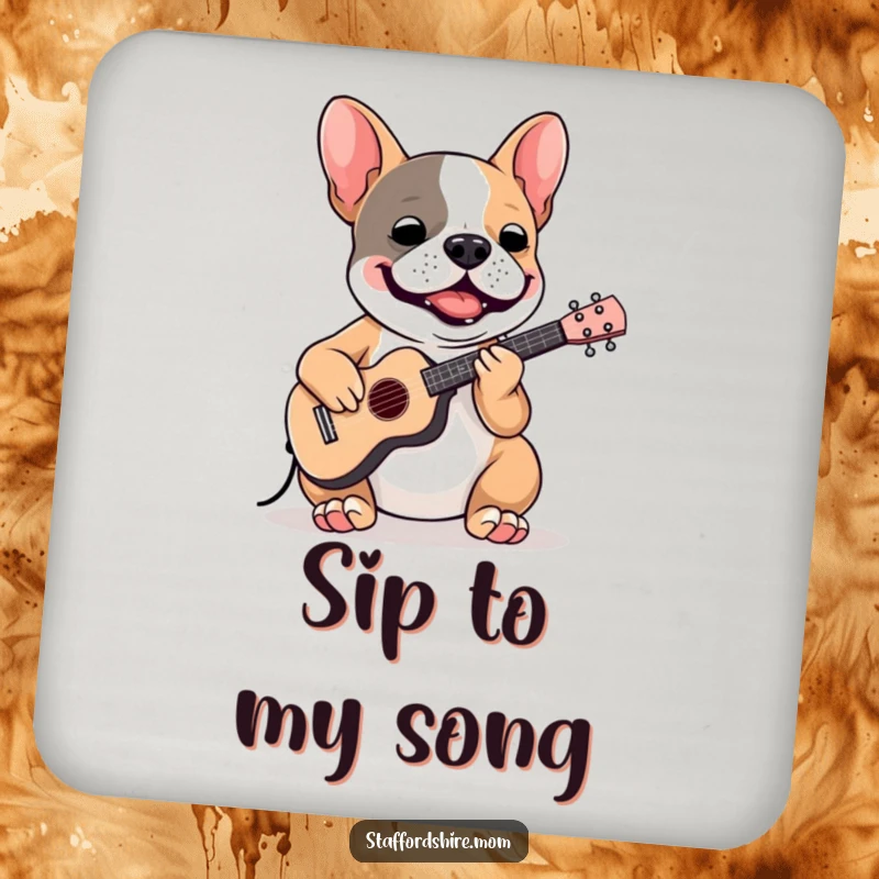 Funny Staffordshire Bull Terrier drink coaster depicting a dog playing a miniature instrument, protecting surfaces with humor.