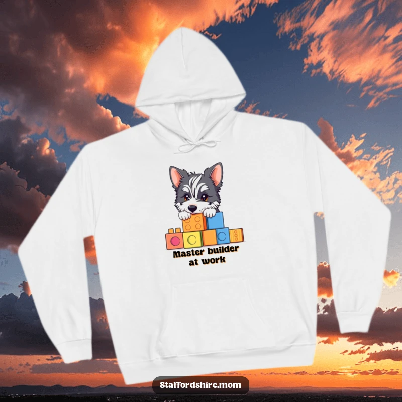 Funny Staffy hoodie with a cute dog peeking over colorful blocks, depicting warmth and playful fun.