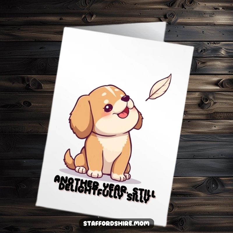 Funny Free Printable Birthday Card: Solid dog looking with amusement at a floating feather, whimsical celebration.