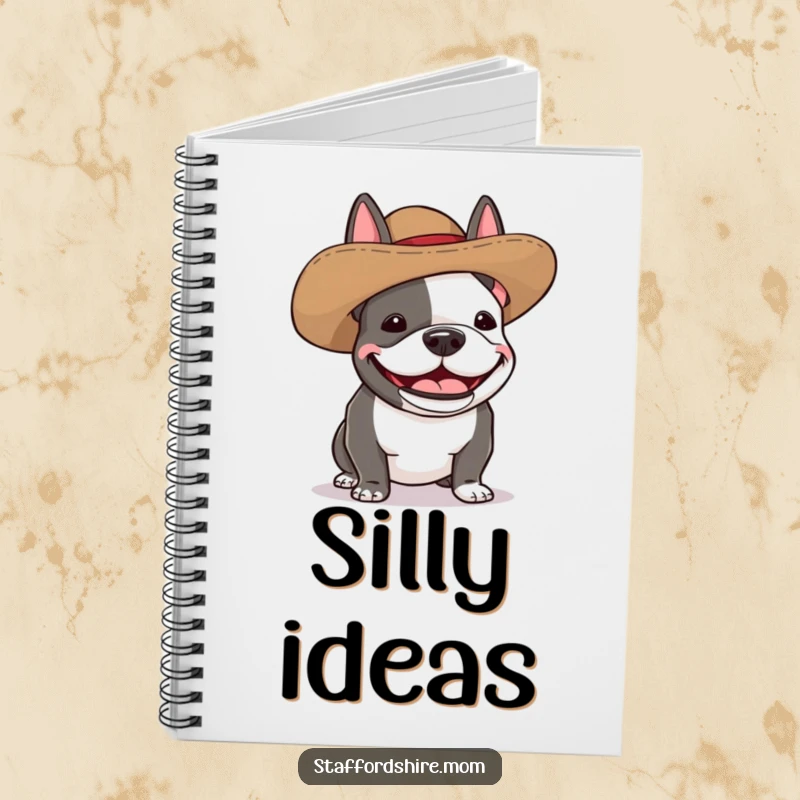 Funny Staffordshire bull terrier notebook showing a dog wearing a silly, oversized hat and giggling with pure amusement.