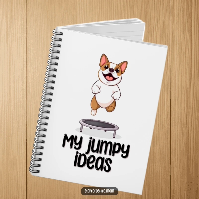 Funny Staffy notebook with a Staffordshire Bull Terrier joyfully bouncing on a trampoline on the cover.