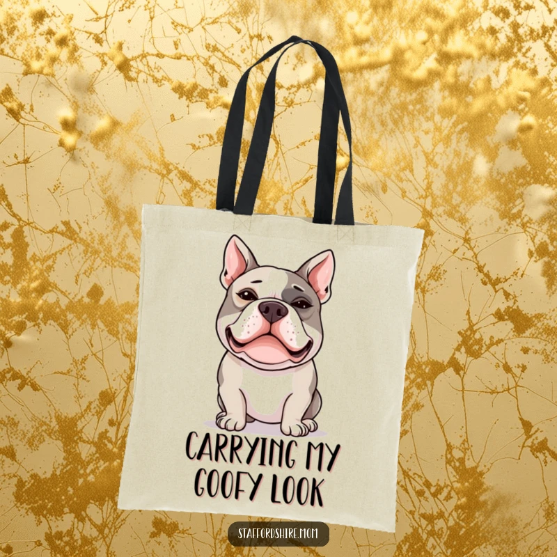 Funny Staffy tote bag featuring a happy Staffordshire Bull Terrier making a funny silly face with crossed eyes.