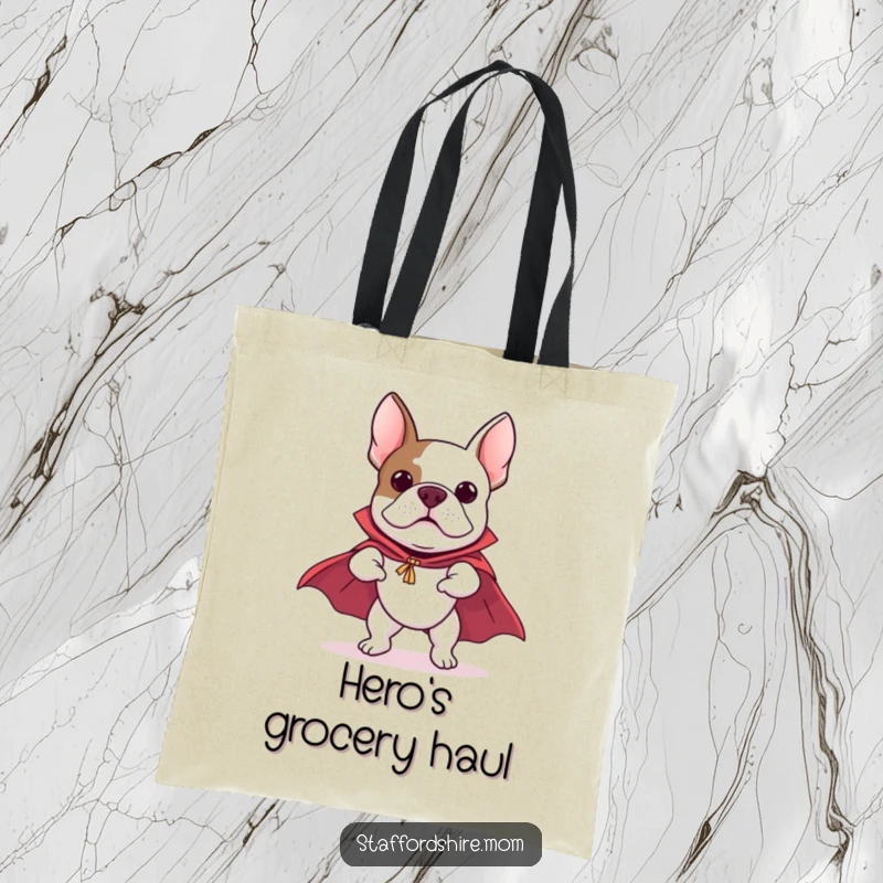 Funny Staffordshire Bull Terrier tote bag featuring a dog in a cape, comically pretending to fly, perfect for stylish and humorous carrying.