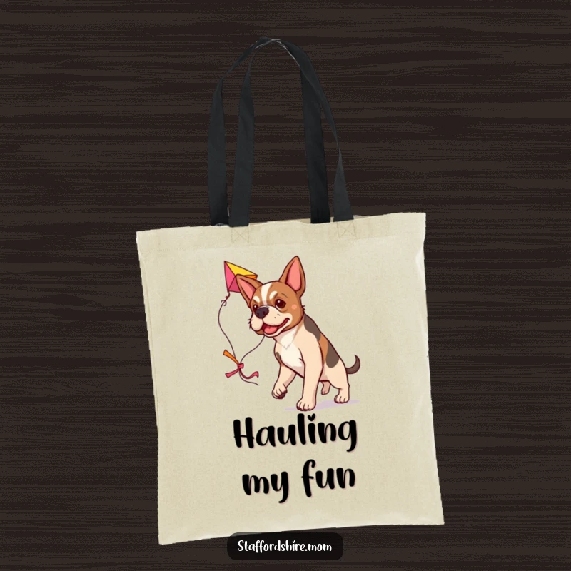 Funny determined Staffordshire dog tote bag, carrying a large colorful kite, humorous and practical.